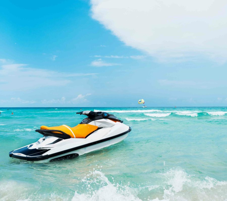 Blue sea and a jet ski floating on the sea, with a blue sky back